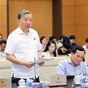 Bộ trưởng Bộ Công an Tô Lâm trình bày Tờ trình về dự án Luật Phòng, chống mua bán người (sửa đổi). (Ảnh: Nhan Sáng/TTXVN)