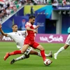 Jordan (áo đỏ) đã vượt qua Iraq để giành vé vào tứ kết Asian Cup 2023. (Ảnh: AFP/TTXVN)