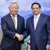 Thủ tướng Phạm Minh Chính tiếp ông Kim Lập Quần, Chủ tịch Ngân hàng Đầu tư Cơ sở hạ tầng Châu Á (AIIB). (Ảnh: Dương Giang/TTXVN)