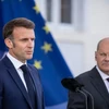 Tổng thống Pháp Emmanuel Macron và Thủ tướng Đức Olaf Scholz. (Nguồn: dpa)