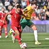 Indonesia (áo đỏ) không thể tạo bất ngờ trước Australia. (Ảnh: AFP/TTXVN)