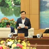 Chủ nhiệm Ủy ban Quốc phòng và An ninh của Quốc hội Lê Tấn Tới trình bày báo cáo. (Ảnh: An Đăng/TTXVN)