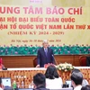 Chủ tịch Ủy ban trung ương Mặt trận Tổ quốc Việt Nam khoá X Đỗ Văn Chiến trả lời phóng viên tại họp báo sau Đại hội. (Ảnh: TTXVN)