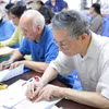 Chi trả lương hưu, trợ cấp bảo hiểm xã hội cho người cao tuổi. (Ảnh: PV/Vietnam+)