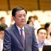 Bộ trưởng Bộ Nông nghiệp và Phát triển Nông thôn Lê Minh Hoan trả lời chất vấn. (Ảnh: Doãn Tấn/TTXVN)