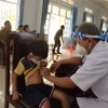 Khám sàng lọc cho trẻ em dân tộc thiểu số. (Ảnh: Nguyên Linh/TTXVN)