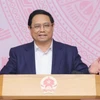 Thủ tướng Phạm Minh Chính, Chủ tịch Ủy ban phát biểu kết luận phiên họp. (Ảnh: Dương Giang/TTXVN)