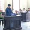 Bị cáo Huỳnh Minh Đương tại phiên tòa sơ thẩm. (Ảnh: TTXVN phát)