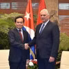 Phó Thủ tướng Trần Lưu Quang hội kiến ông Miguel Diaz-Canel, Bí thư thứ nhất Ban Chấp hành Trung ương Đảng cộng sản Cuba, Chủ tịch nước Cuba, chiều 15/4, tại Cung Cách mạng ở Thủ đô La Habana. (Ảnh: VGP/TTXVN phát)
