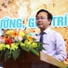 Ông Hoàng Xuân Tân, Phó Chủ tịch Ủy ban Nhân dân tỉnh Quảng Bình phát biểu tại hội nghị. (Ảnh: Võ Dung/TTXVN)