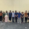 Các đối tượng trong đường dây ghi số lô, đề bị bắt giữ. (Ảnh TTXVN: phát)