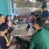 Người dân Làng Nủ trở về an toàn sau mưa lũ. (Ảnh: TTXVN phát)