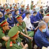 Các bị cáo tại phiên tòa ngày 12/3. (Ảnh: Thanh Vũ/TTXVN)