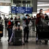 Hành khách tại sân bay quốc tế ở Bắc Kinh, Trung Quốc. (Ảnh minh họa: AFP/TTXVN)