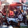 Người bị thương được chăm sóc sau vụ tấn công. (Ảnh: Sydney Morning Heral)