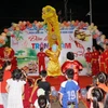 Tiết mục múa lân trong Đêm hội Trăng rằm. (Ảnh: Đỗ Bá Thành/TTXVN)