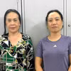Nguyễn Thị Linh (trái) và Lý Thị Ngọc Bích tại Cơ quan điều tra. (Ảnh: TTXVN)