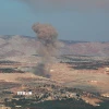 (Tư liệu) Khói bốc lên sau một vụ không kích tại Idlib, Syria. (Ảnh: AFP/TTXVN)