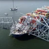 Tàu container Dali treo cờ Singapore đâm sập cầu Francis Scott Key ở thành phố Baltimore, bang Maryland (Mỹ), ngày 26/3/2024. (Ảnh: AFP/TTXVN)