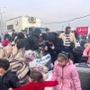 Người dân Syria trở về quê hương từ cửa khẩu Cilvegozu ở Hatay, Thổ Nhĩ Kỳ, ngày 12/12/2024. (Nguồn: THX/TTXVN) 