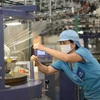 Doanh nghiệp dệt may chuyển đổi xanh, đáp ứng các tiêu chuẩn cao của thị trường. (Ảnh: PV/Vietnam+)