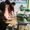 Chỉ số giá nhóm thực phẩm trong tháng cũng tăng cao trước nhu cầu tiêu dùng của người dân trong ngày Lễ ông Công, ông Táo và dịp Tết Nguyên đán. (Ảnh: Vietnam+)