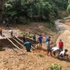 Điểm giao giữa đường Lê Thánh Tông và Thanh Tịnh ở thành phố Đông Hà (Quảng Trị) bị ngập do mưa lớn. Ảnh: Nguyên Lý-TTXVN