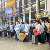 Lao động chuẩn bị xuất cảnh đi làm việc ở nước ngoài. (Ảnh: PV/Vietnam+)
