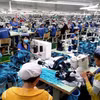 Sản xuất hàng may mặc xuất khẩu tại Công ty may mặc New Apparel, Khu công nghiệp Bắc Đồng Phú, tỉnh Bình Phước. (Ảnh: Dương Chí Tưởng/TTXVN) 