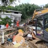Hiện trường vụ lở đất tại Hoành Dương, tỉnh Hồ Nam, Trung Quốc. (Ảnh: THX/TTXVN)