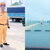 Thiếu tá Phạm Minh Hướng, cán bộ Phòng Cảnh sát Giao thông Công an thành phố Cần Thơ dùng xe môtô chuyên dùng dẫn đường cho xe ôtô chở sản phụ bị vỡ ối đến bệnh viện kịp thời. (Ảnh: Công an cung cấp)