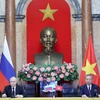 Chủ tịch nước Tô Lâm và Tổng thống Liên bang Nga Vladimir Putin tại cuộc họp báo chung. (Ảnh: Nhan Sáng/TTXVN)