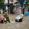 Ngập lụt tại phố Tân Ấp, phường Phúc Xá, quận Ba Đình.( Ảnh: Thanh Tùng/ TTXVN)