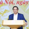 Thủ tướng Phạm Minh Chính chủ trì Hội nghị sơ kết 6 tháng Ủy ban Quốc gia về chuyển đổi số và Đề án 06. (Ảnh: Dương Giang/TTXVN)