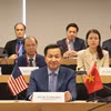 Phó Thủ tướng Chính phủ Lê Minh Khái trao đổi trực tuyến với Đại diện Thương mại Hoa Kỳ Katherine Tai. (Ảnh: Thanh Tuấn/TTXVN)