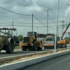 Máy móc thi công tại Khu tái định cư Long Đức. (Ảnh: Công Phong/TTXVN)