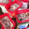 Mực được bà con ngư dân Hà Tĩnh chia thành nhiều loại theo kích cỡ và có giá bán khác nhau. (Ảnh: Hữu Quyết/ TTXVN)