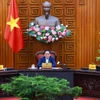 Thủ tướng Phạm Minh Chính chủ trì họp Thường trực Chính phủ về kiểm soát lạm phát. (Ảnh: Dương Giang/TTXVN)