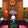 Thủ tướng Phạm Minh Chính chủ trì làm việc với các bộ, ngành, địa phương để đẩy nhanh tiến độ hoàn thành Dự án đường dây tải điện 500kV mạch 3. (Ảnh: Dương Giang/TTXVN)