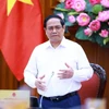 Thủ tướng Phạm Minh Chính kết luận buổi làm việc với các đơn vị để đẩy nhanh tiến độ hoàn thành Dự án đường dây 500kV mạch 3. (Ảnh: Dương Giang/TTXVN)