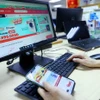 Giao dịch thương mại điện tử. (Ảnh: Phạm Hậu/TTXVN)
