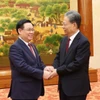Chủ tịch Quốc hội Vương Đình Huệ với Ủy viên trưởng Ủy ban Thường vụ Nhân đại toàn quốc Trung Quốc Triệu Lạc Tế. (Ảnh: Nhan Sáng/TTXVN)