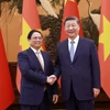 Thủ tướng Phạm Minh Chính hội kiến Tổng Bí thư, Chủ tịch nước Trung Quốc Tập Cận Bình. (Ảnh: Dương Giang/TTXVN)