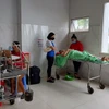 Hai bệnh nhân bị thương được phẫu thuật tại Bệnh viện đa khoa vùng Tây Nguyên. Ảnh: Tuấn Anh - TTXVN