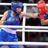 Võ sỹ boxing Hà Thị Linh liên tuc có những cú ra đòn trúng đích. (Ảnh: Hoàng Linh/TTXVN)