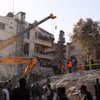 Hiện trường một tòa nhà bị tấn công do bị không kích ở Damascus, Syria, ngày 20/1/2024. (Ảnh AP)