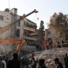 Hiện trường một tòa nhà bị tấn công do bị không kích ở Damascus, Syria, ngày 20/1/2024. (Ảnh AP)