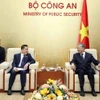 Đại tướng Tô Lâm, Bộ trưởng Bộ Công an tiếp Đại tá Khonsi Naovalat, Trưởng Cơ quan đại diện Bộ Công an Lào tại Việt Nam. (Ảnh: Phạm Kiên/TTXVN)