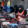 Phụ nữ Afghanistan làm việc tại một xưởng may ở tỉnh Herat ngày 7/8/2023. (Ảnh: AFP/TTXVN)