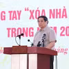 Thủ tướng Phạm Minh Chính phát động Phong trào thi đua “Xóa nhà tạm, nhà dột nát” trong cả nước. (Ảnh: Dương Giang/TTXVN)